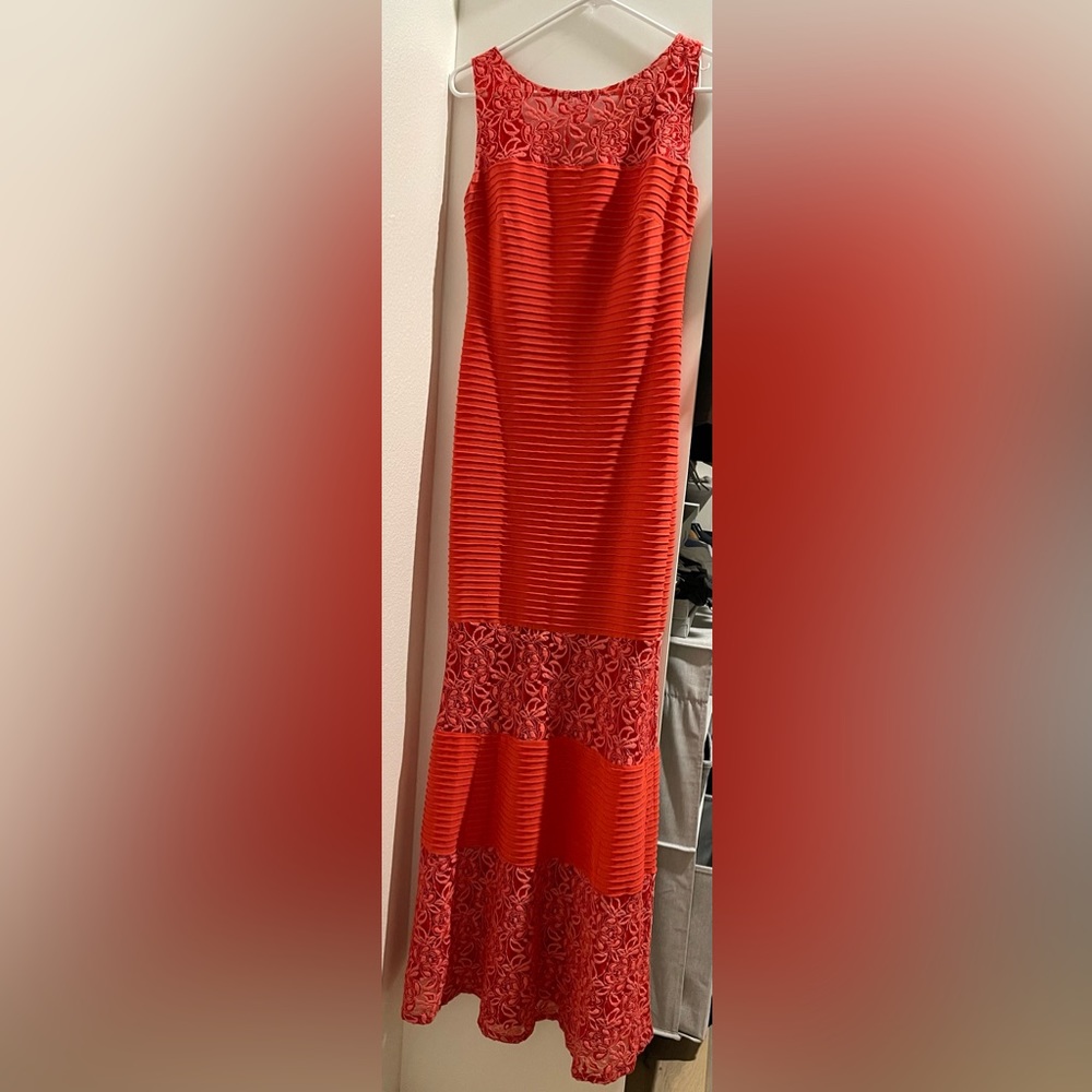 Beautiful, coral colored, lace formal dress.